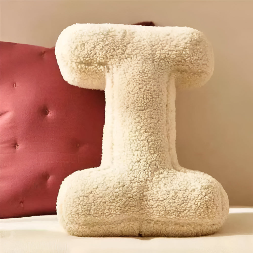 Cojín decorativo con letra del alfabeto estilo almohada