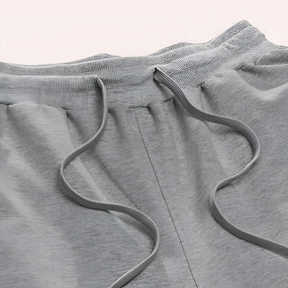 Herre sweatpants med vid ben, snøre og afslappet joggerstil