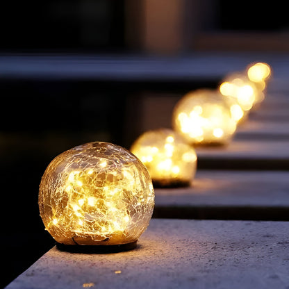 Luci solari Sfera di vetro crepitante a forma di globo per sentieri con bagliore esterno